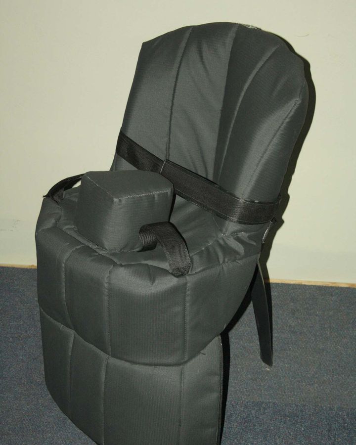 The charcoal LiTa Practice chair, fully padded, with a hip support block and a strap across the backrest.